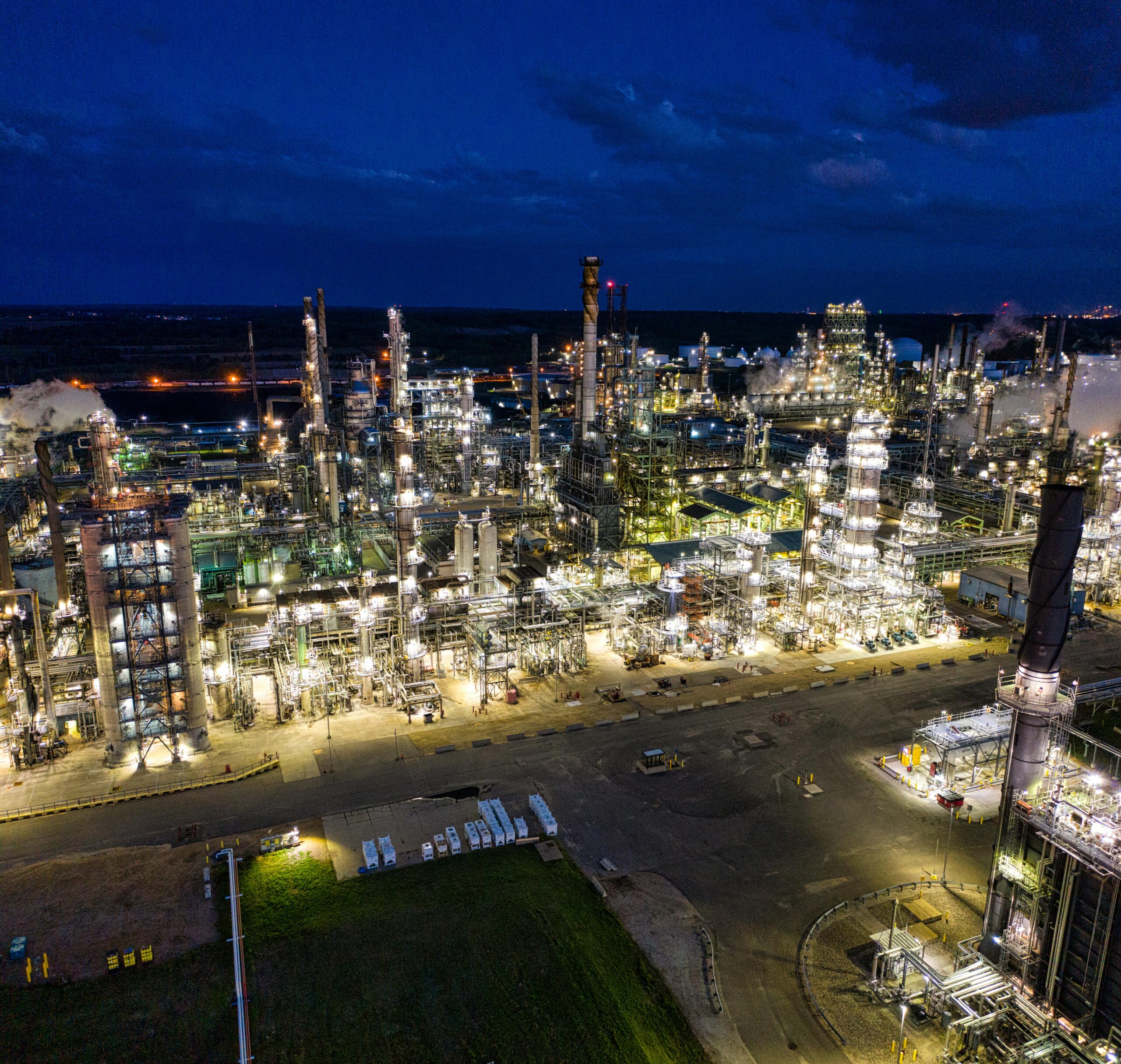 pexels-photo-10386893-10386893 Dramatic aerial shot of an illuminated oil refinery at night in Rosemount, MN.
